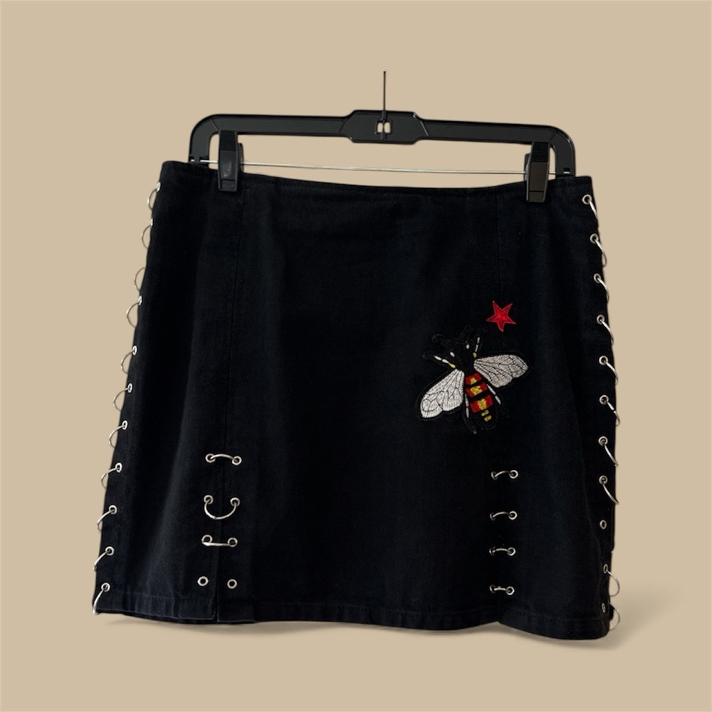 Moto TopShop Embroidered Black Skirt with  Design and rings on the sides.
